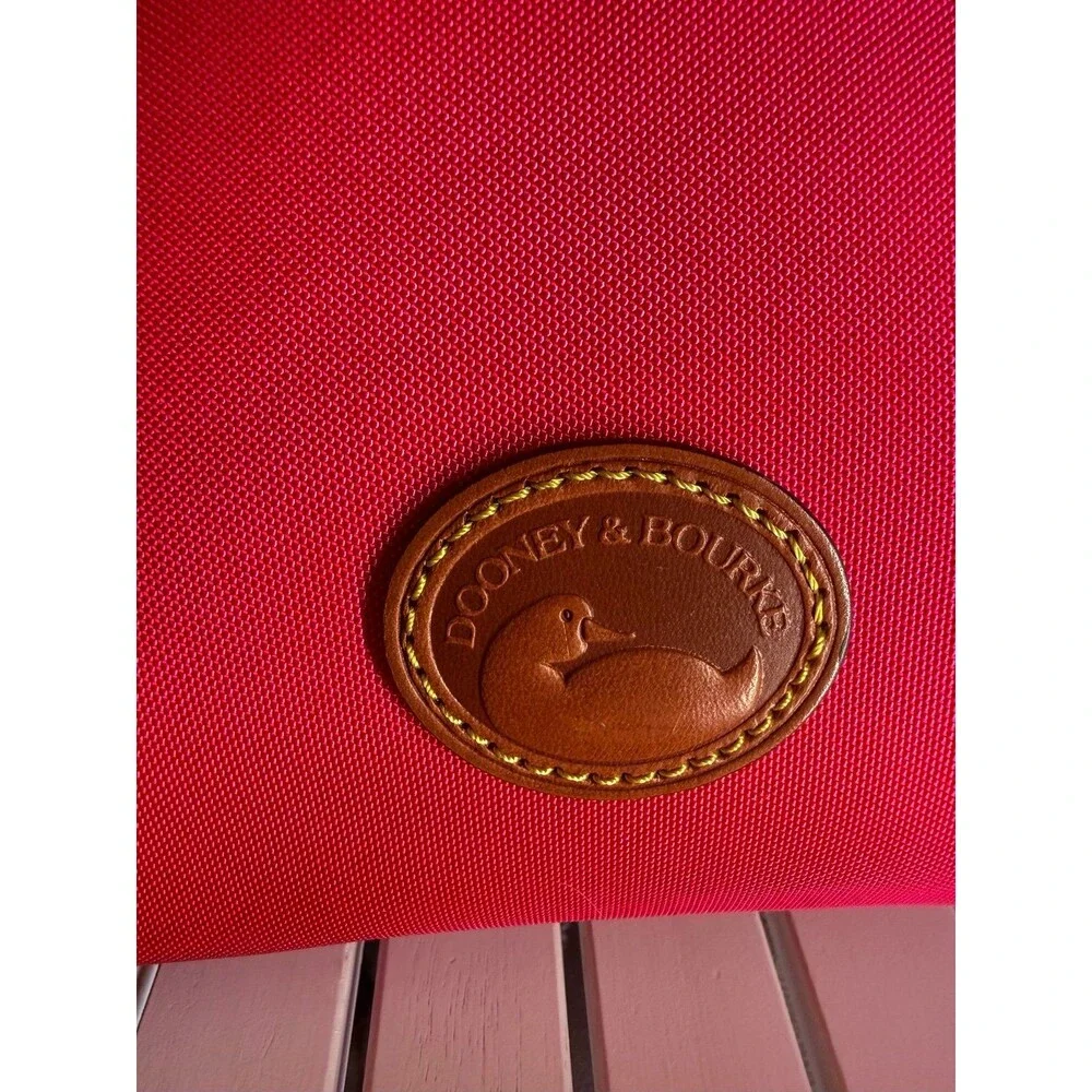 Genuine Dooney and Bourke Zip Crossbody Bag in Hot Pink MSRP $218.00 like new